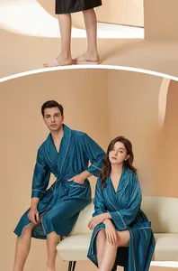 Detail of teal couple robes featuring vertical stripes and elegant white piping on shawl collar