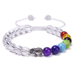 Detail of beaded yoga bracelet with 7 chakra stones and antique silver elephant charm