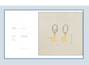 Detailed view of 18k gold plated hoop earrings with clustered natural pearl charms