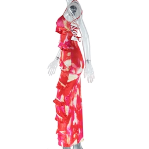 Detail of pink abstract print satin dress featuring back tie and ruffled asymmetric hem