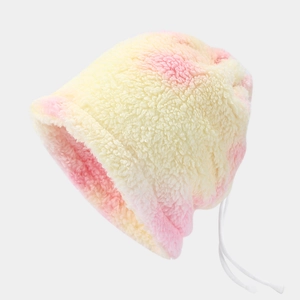 Detailed macro view of tie-dye lamb wool hat with adjustable white drawstring straps