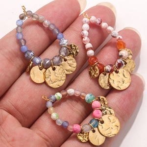 Handmade bohemian teardrop earrings with natural stone beads and hammered gold coin charms