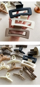 Detail view of large matte hair claws in various Morandi tones and elegant shapes