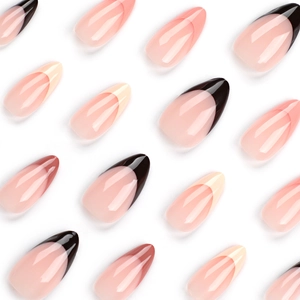 Glossy nude press-on nails with black and white French tips in stiletto and coffin shapes