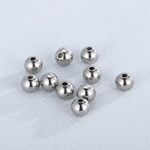 Macro shot of 10 polished silver stainless steel spacer beads for DIY jewelry making