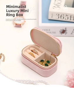 Detailed internal storage view of a pink velvet travel mini ring and jewelry organizer