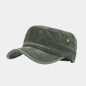 Detail of army green cadet cap showing metal air vents and washed cotton texture