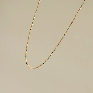 Detail of 18K gold plated titanium steel chain with multi-colored enamel beads