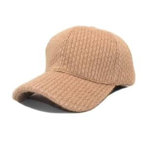Detail of camel knit baseball cap showing thick mohair texture and warm winter material