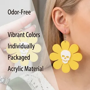 Halloween acrylic earrings featuring yellow flower petals and skull motifs on hooks