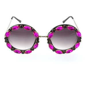 Detail of round sunglasses with pink marquise crystals and grey gradient lenses
