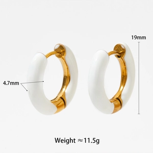 Detail view of gold and white enamel hoop earrings with size 19mm and weight 11.5g