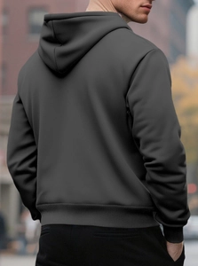 Rear view of a dark grey men's fleece hoodie featuring a ribbed hem and a urban street style