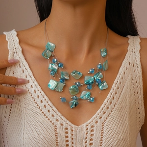 Bohemian multi-layer necklace with blue crystal beads and irregular shell pendants