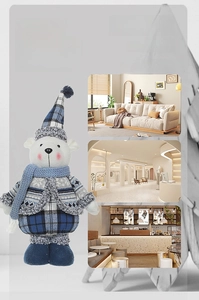 Detail of stretchable Christmas polar bear doll in blue plaid outfit and knit scarf
