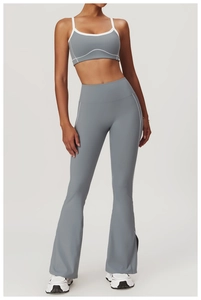 Detail view of grey yoga set with white piping on sports bra and flared leggings