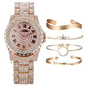 Detailed set featuring a luxury gold quartz watch with rhinestones and four elegant bracelets