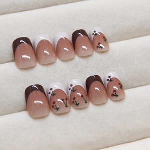 French style cherry pattern press-on nails with deep red tips on pink base