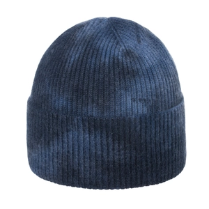 Detailed view of the dark blue tie-dye knit beanie featuring thick ribbed texture and wide cuff
