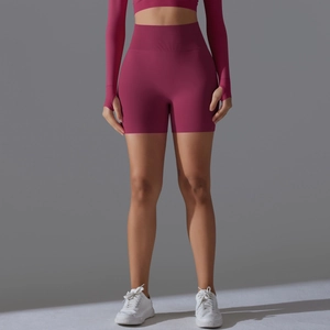 Detail of high waisted seamless yoga shorts with ribbed waistband in dark pink