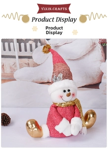 Detail of Christmas snowman plush with red sequin hat and gold scarf ornament