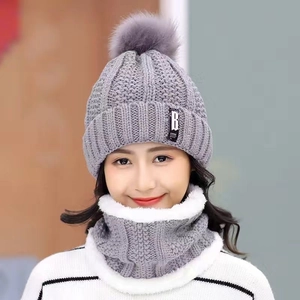 Winter fleece-lined knitted beanie and neck warmer set for women with grey pompom detail