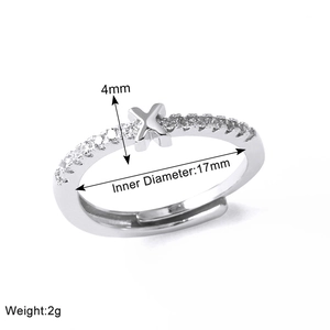 Detailed view of silver X-letter ring showing 4mm width and 17mm inner diameter specs