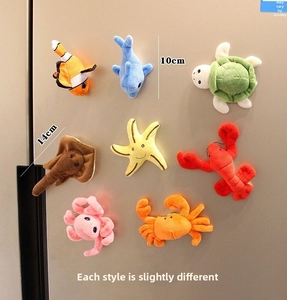 Detailed plush sea animal magnets set with colorful clownfish and dolphin figures