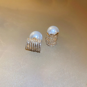 Elegant geometric faux pearl stud earrings with crystal-encrusted gold spiral settings