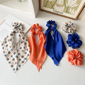 French style bow hair scrunchies with long ribbons in solid blue and geometric patterns