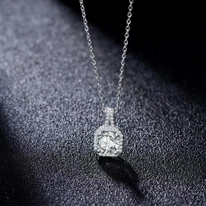 Elegant silver necklace with square cubic zirconia pendant on dark textured background