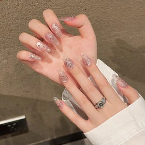 Pink velvet cat-eye press-on nails with 3D pearls and heart charms in stiletto shape