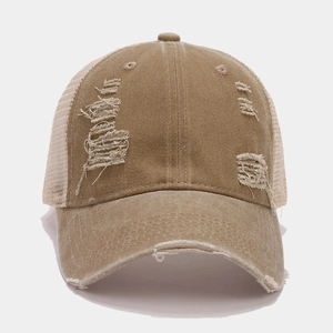 Close-up of distressed vintage khaki mesh baseball cap showing breathable nylon detail
