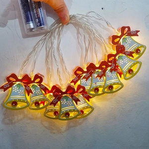 LED Christmas bell string lights with red bows and warm yellow glow, battery operated