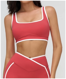 Detail of square neck sports bra with white piping and V-shape waistband detail