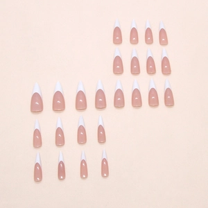 Classic French press on nails in milky white and nude pink with a long stiletto shape