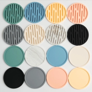 Thick round silicone coasters in multiple colors with heat-resistant non-slip texture