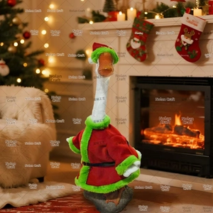 Detail of white garden goose statue in red velvet Santa costume near a cozy fireplace