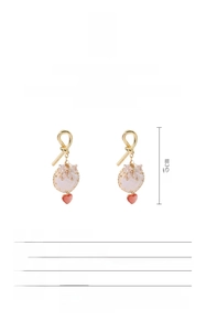Detail view of Baroque pearl earrings with 18k gold plating and dimension markings
