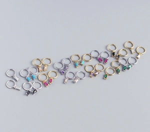 Detailed view of sterling silver hoop earrings with colorful rectangular zircons