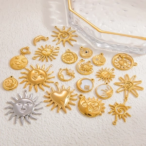 Gold plated stainless steel sun and heart charms for DIY jewelry making on white background