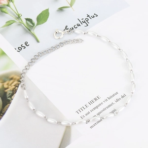 Detail of beaded pearl bracelet with silver extension chain and lobster clasp closure