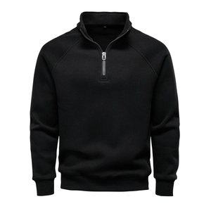 Macro shot of men's black half-zip sweatshirt featuring a textured vertical knit pattern