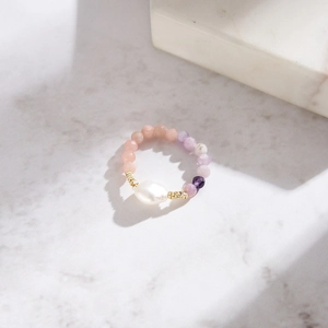 Baroque pearl beaded ring with pink and purple natural stone gradient on marble