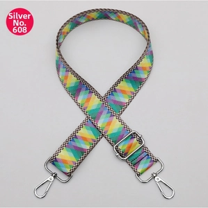 Detail of adjustable colorful argyle bag strap with silver metal lobster clasps