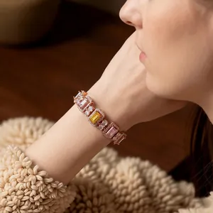 French court style rose gold bracelet with pink and yellow square zircons on a wrist