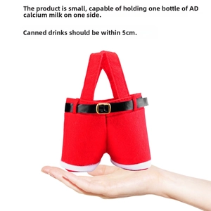 Detail of red Santa pants gift bag with white faux fur trim and belt buckle handle
