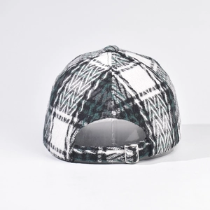Close-up of the adjustable metal buckle and thick plaid fabric on the back of the cap