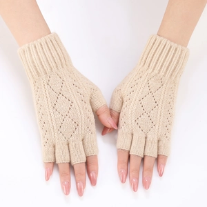 Close-up of beige diamond knit fingerless arm warmers with detailed stitching texture