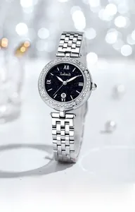 Close-up of starry blue dial women's watch with luminous date and crystal bezel